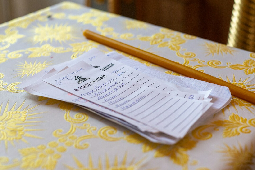 Stacks of official documents and environmental permits on a newsroom desk